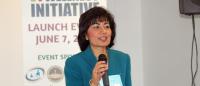 Dr. Ginny Mantello speaking at an event, at podium.